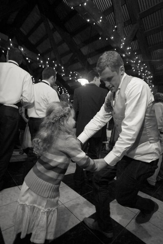 groom dancing with a kid